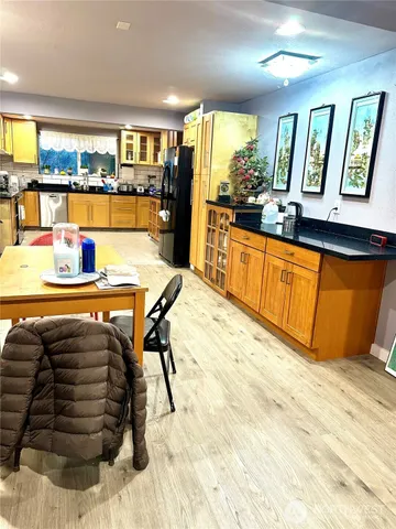 a dining room with furniture and window