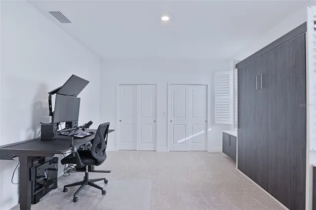 a view of a workspace with furniture