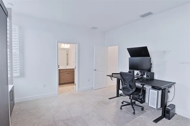 a view of a workspace with furniture