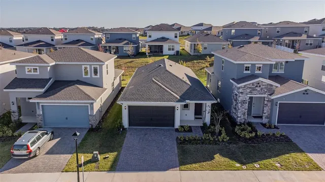 an aerial view of residential building and parking space