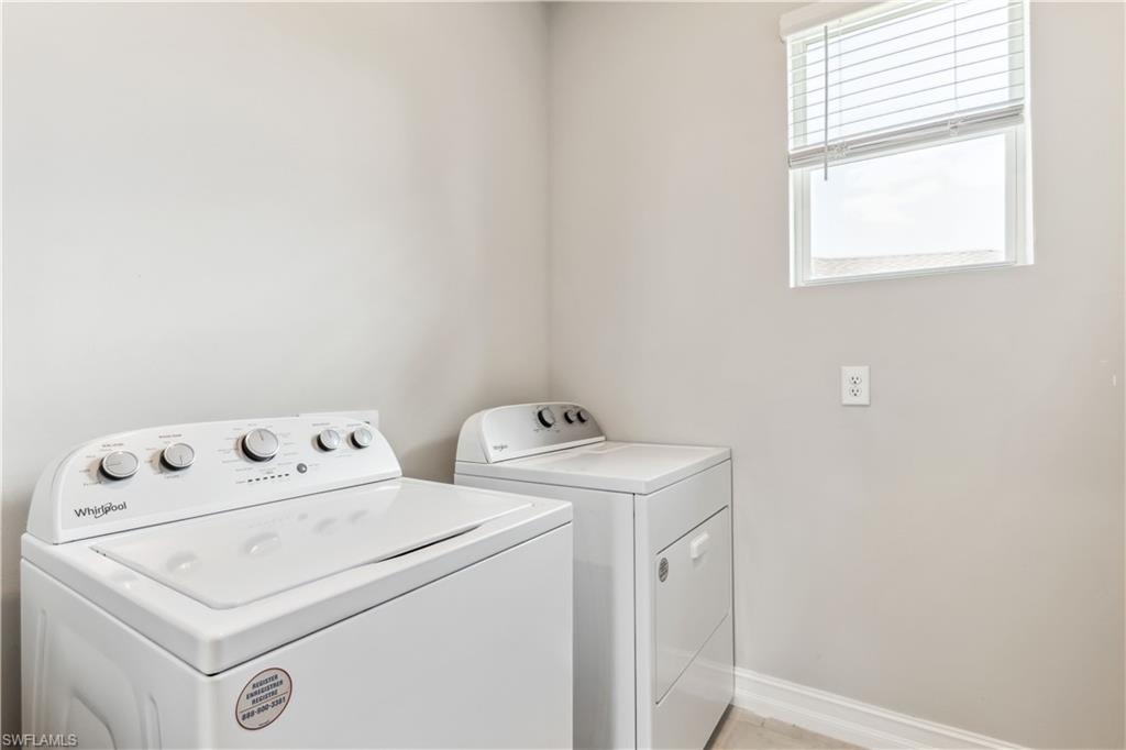826 Friendship Circle LaBelle, FL 33935 - Photo 16 of 19 a utility room with dryer and washer