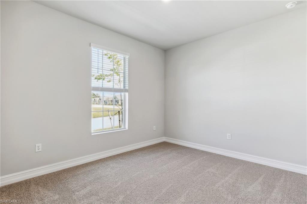 826 Friendship Circle LaBelle, FL 33935 - Photo 19 of 19 an empty room with a window