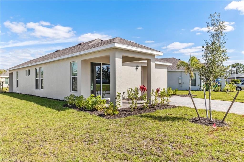 826 Friendship Circle LaBelle, FL 33935 - Photo 4 of 19 a view of house with backyard porch and entertaining space