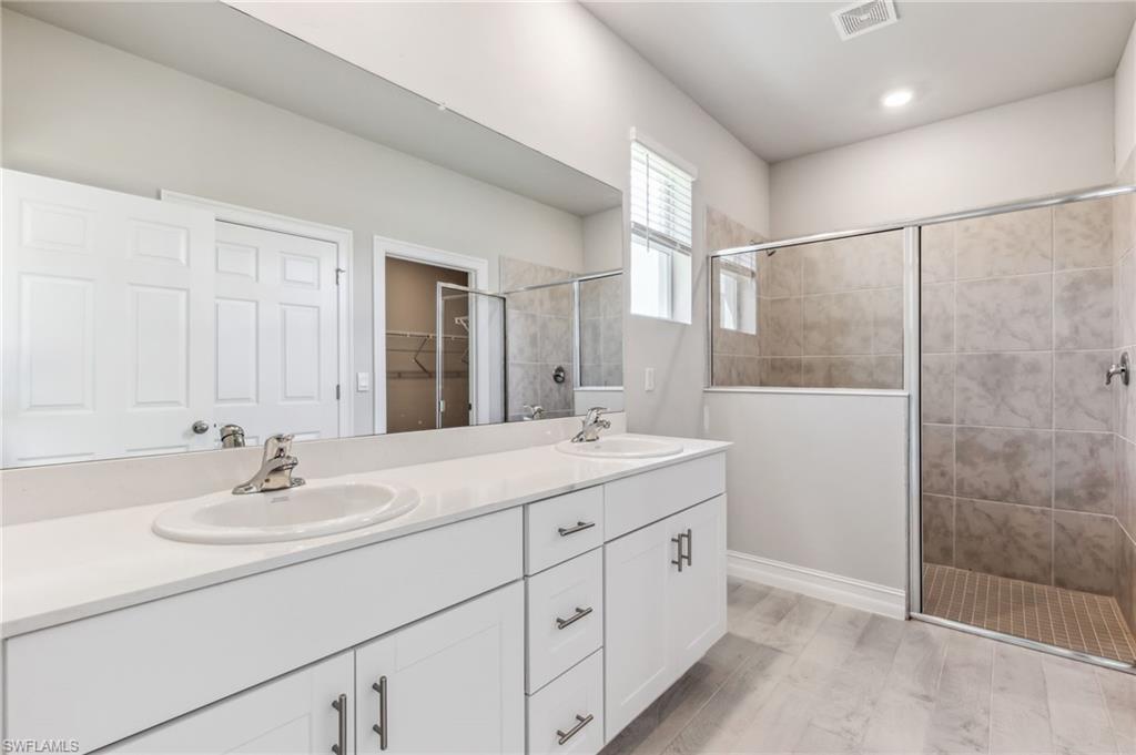 826 Friendship Circle LaBelle, FL 33935 - Photo 5 of 19 a bathroom with a sink and a mirror