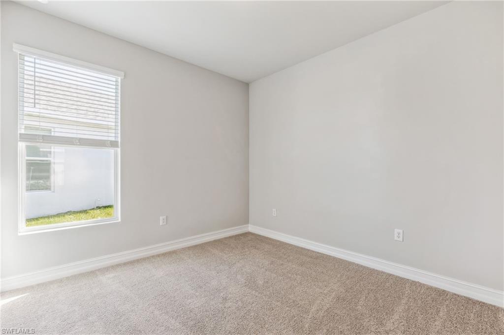 826 Friendship Circle LaBelle, FL 33935 - Photo 7 of 19 an empty room with a window