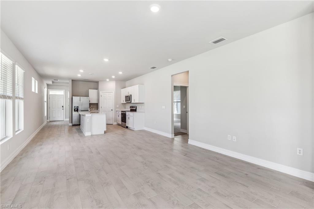 826 Friendship Circle LaBelle, FL 33935 - Photo 9 of 19 a view of a livingroom with a kitchen