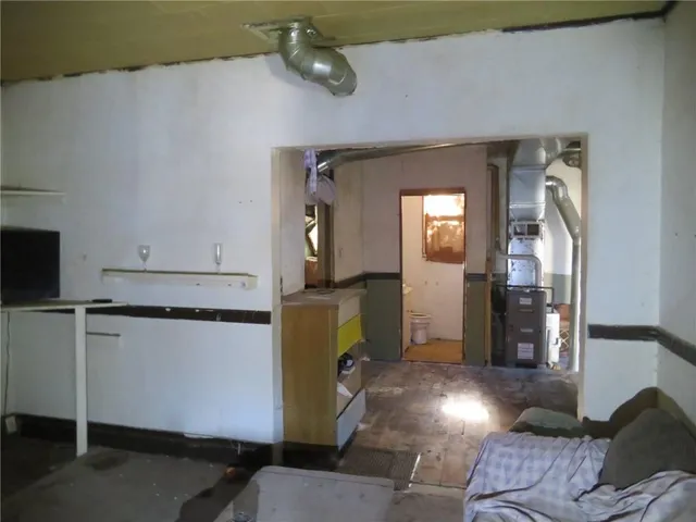 a view of a livingroom with furniture and a window