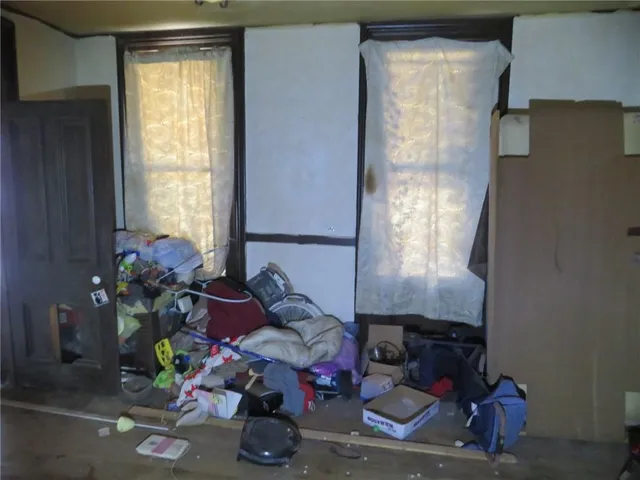 a living room with furniture and flowers