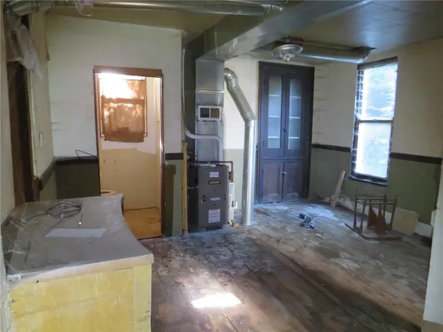 a kitchen with a sink stove and refrigerator