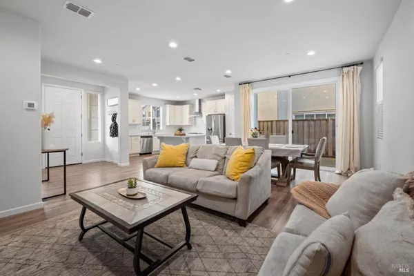 a living room with furniture and a table