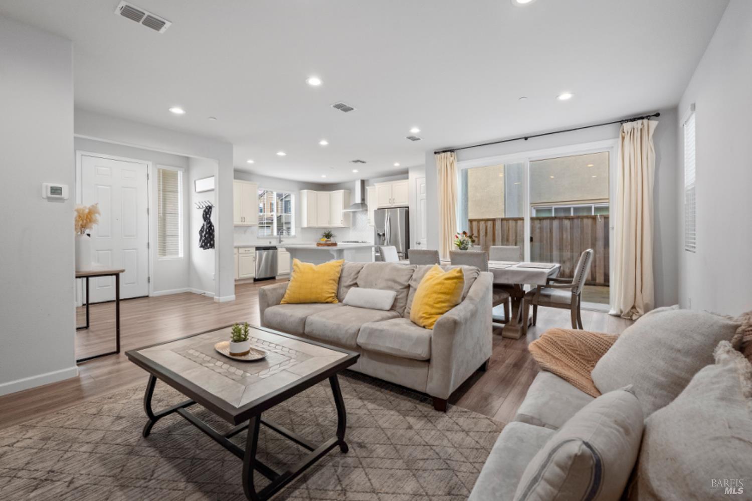 a living room with furniture and a table