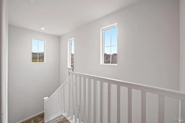 a view of a hallway with windows