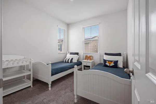 a bedroom with furniture and a window
