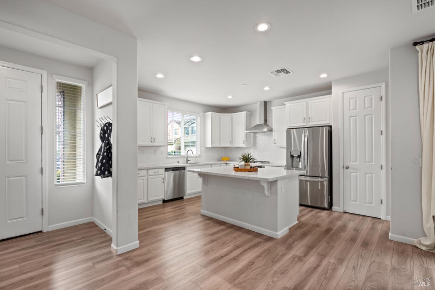 2148 Karen Place Rohnert Park, CA 94928 - Photo 4 of 25 a kitchen with a refrigerator and a stove top oven