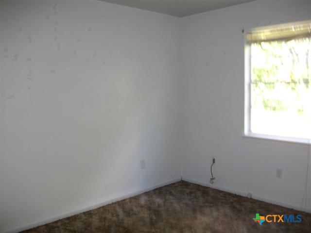 702 North 1st Street, Unit 3 Copperas Cove, TX 76522 - Photo 5 of 7 a view of an empty room and a window