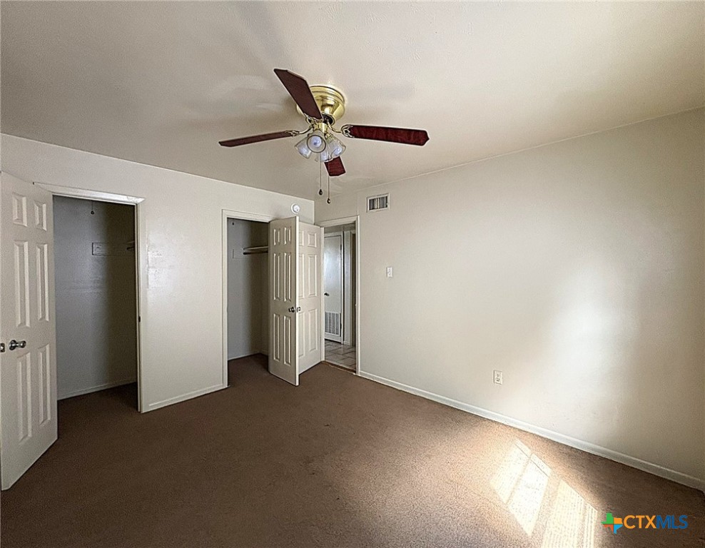 702 North 1st Street, Unit 5 Copperas Cove, TX 76522 - Photo 6 of 8 a view of a livingroom with a ceiling fan and window