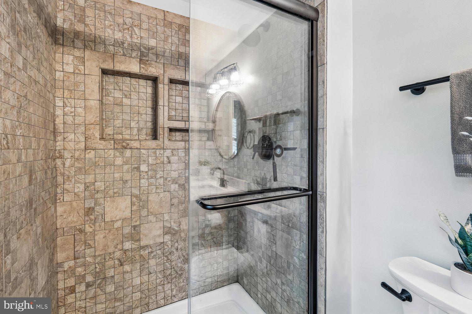 8044 Red Jacket Way Jessup, MD 20794 - Photo 39 of 71 WALK-IN SHOWER W/ TOILETRY NICHES & TILE SURROUND