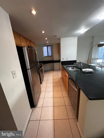 a view of hallway with wooden floor