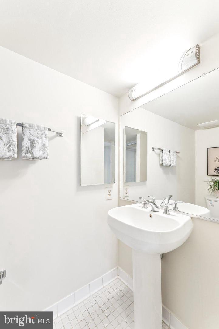 1225 13th Street Northwest, Unit 712 Washington, DC 20005 - Photo 13 of 21 Bright and airy bathroom with modern fixtures.