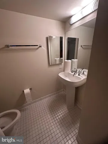 a bed sitting in a room next to a window