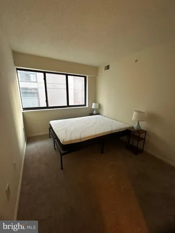 a room with pool table and windows