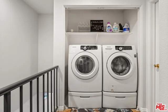 a close view of utility room with washer and dryer