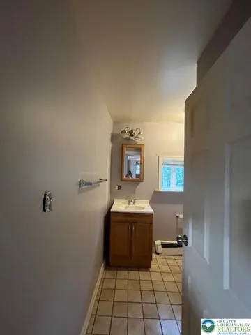 a room with a sink and cabinets
