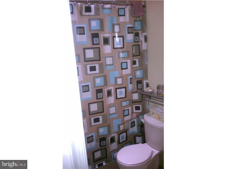 256 Glendale Road Upper Darby, PA 19082 - Photo 11 of 13 a bathroom with a toilet and a shower