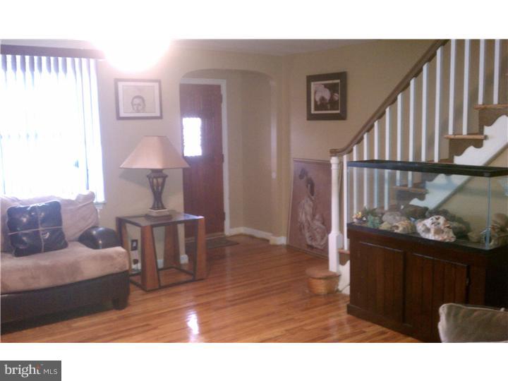 256 Glendale Road Upper Darby, PA 19082 - Photo 3 of 13 a living room with furniture and a wooden floor