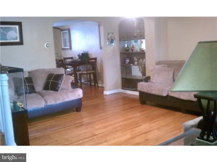 256 Glendale Road Upper Darby, PA 19082 - Photo 4 of 13 a living room with furniture and wooden floor