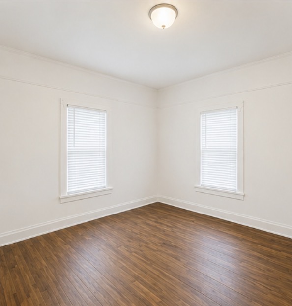 204 G Street Anderson, SC 29625 - Photo 4 of 8 Rich hardwood flooring complements the naturally illuminated interior with well-appointed windows.