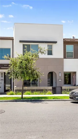 a view of swimming pool with outdoor seating and house in its background