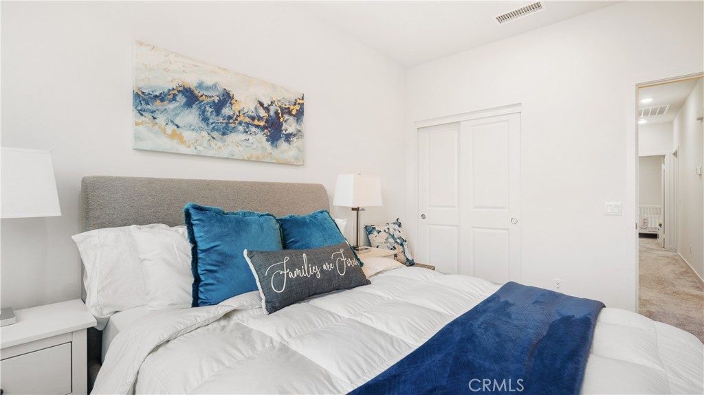 3610 East Pollock Street, Unit 4 Ontario, CA 91761 - Photo 27 of 47 a bedroom with a bed and a couch