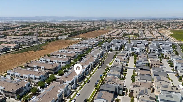 an aerial view of a city with ocean view