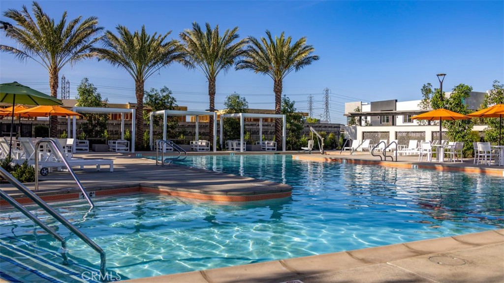 3610 East Pollock Street, Unit 4 Ontario, CA 91761 - Photo 39 of 47 a view of swimming pool with a table and chairs