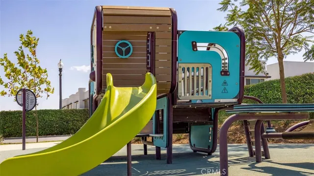a view of swimming pool with a table and chairs
