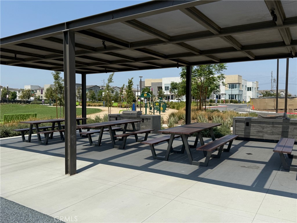 3610 East Pollock Street, Unit 4 Ontario, CA 91761 - Photo 47 of 47 a view of a patio with a table and chairs