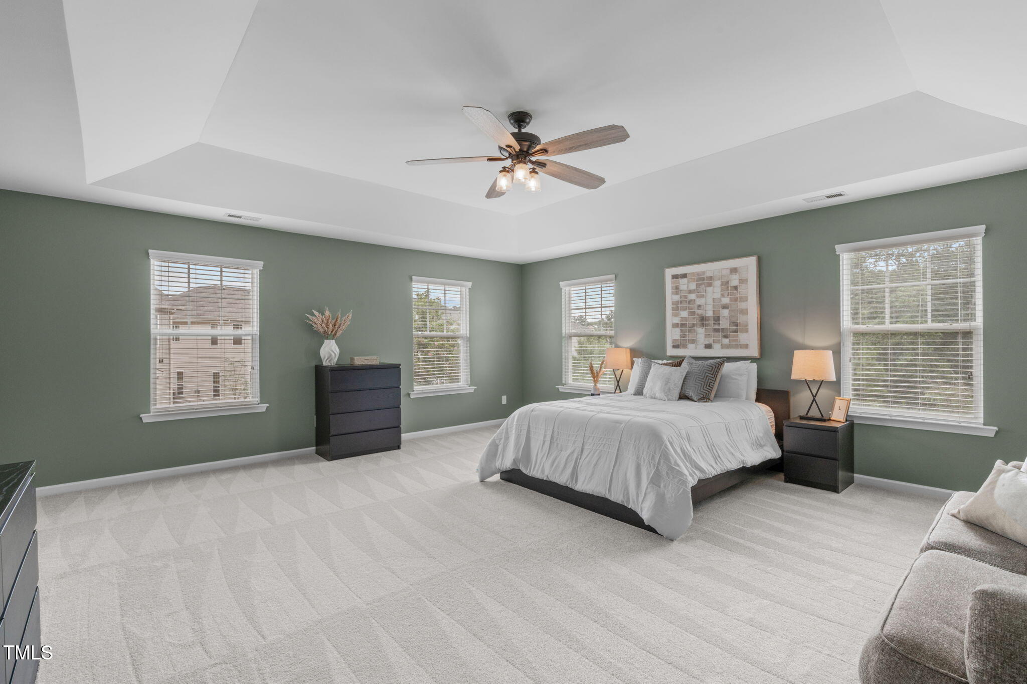 1909 Ferntree Court Morrisville, NC 27560 - Photo 16 of 38 a spacious bedroom with a large bed and a window