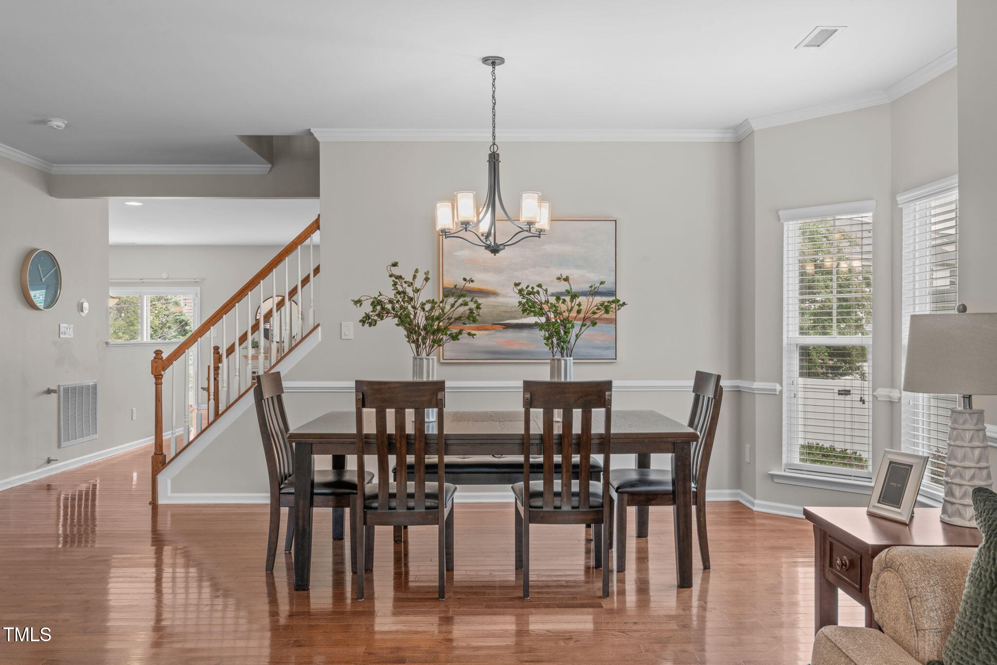 1909 Ferntree Court Morrisville, NC 27560 - Photo 2 of 38 a view of a dining room with furniture window and wooden floor
