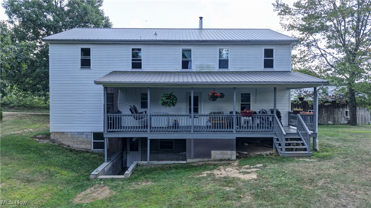 91240 Kilgore Ridge Road Scio, OH 43988 - Photo 5 of 43 Back of house with covered porch, a yard, a metal roof, and stairs