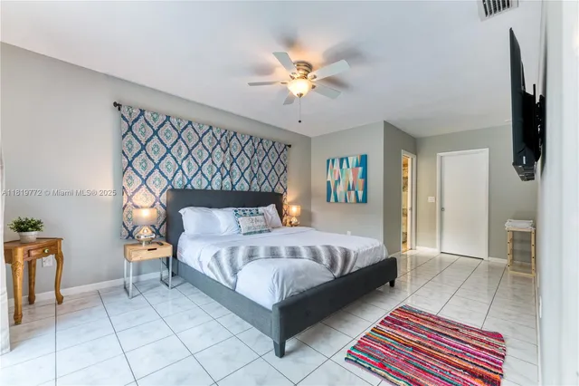 a bed room with a bed and a chandelier