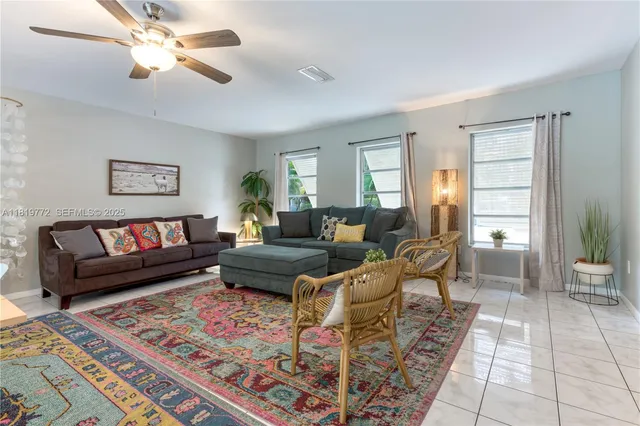 a living room with furniture and a rug