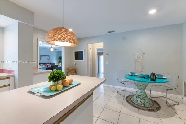 a kitchen with a table and a sink