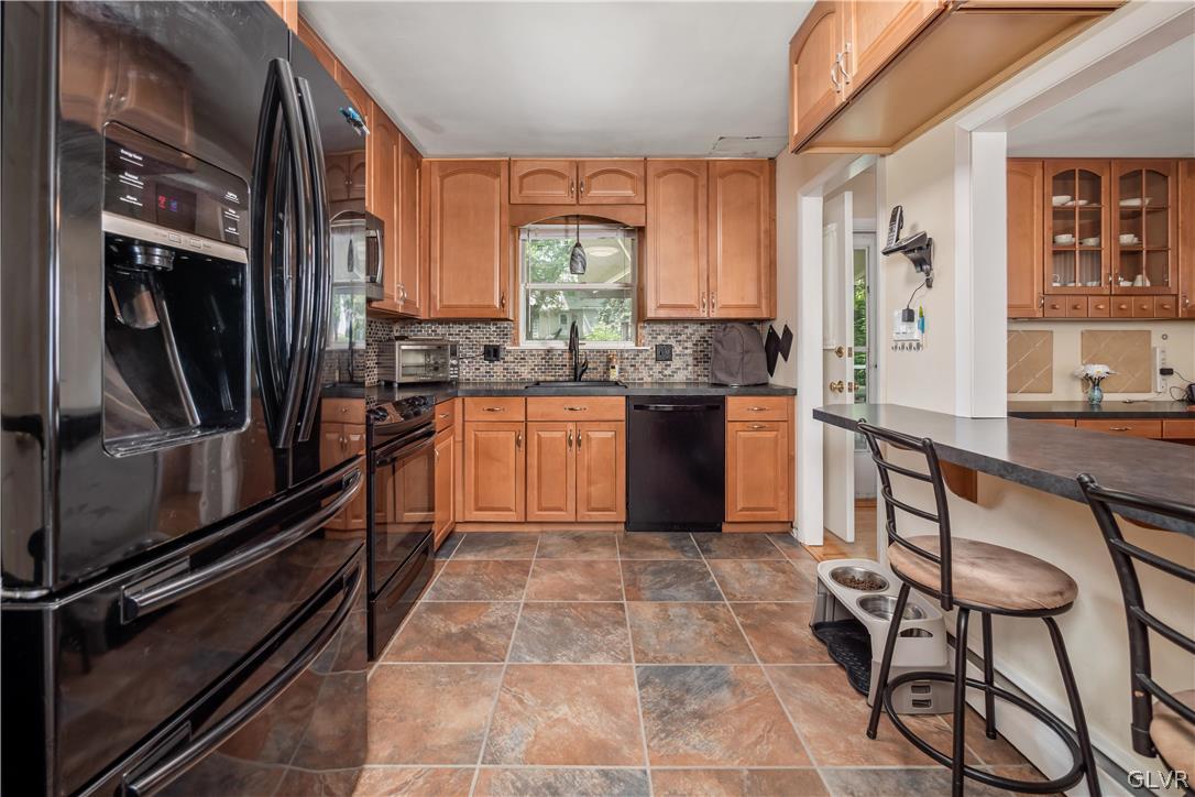 2439 Congress Street Allentown, PA 18104 - Photo 12 of 32 Bar seating with buffet style window into the dinn