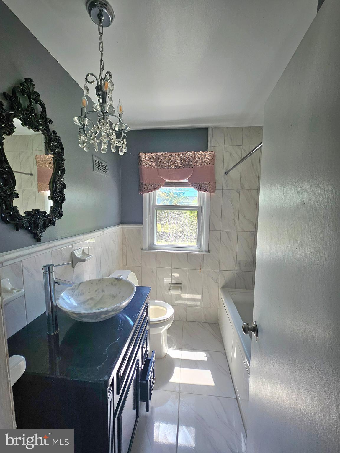 148 Church Road Elkins Park, PA 19027 - Photo 25 of 33 a view of a dining room with furniture and a chandelier