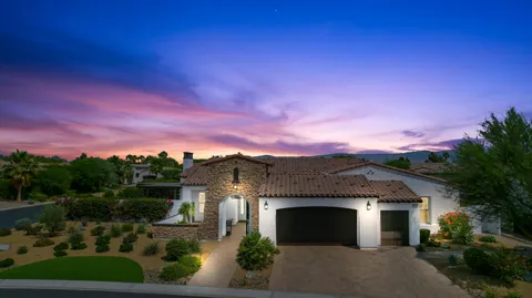 a living room with fireplace furniture and a flat screen tv