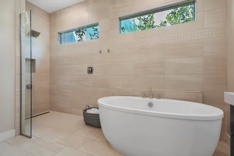 a bathroom with a toilet a sink and shower