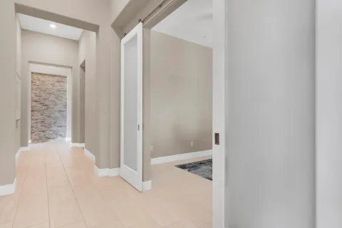 a swimming pool with outdoor seating and patio