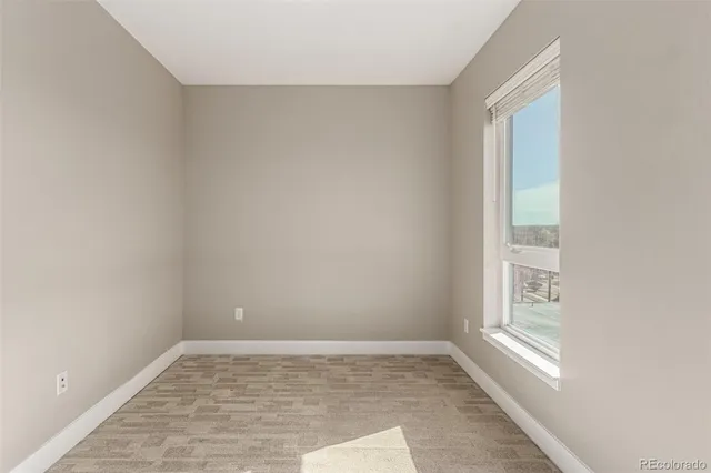 a view of an empty room and window