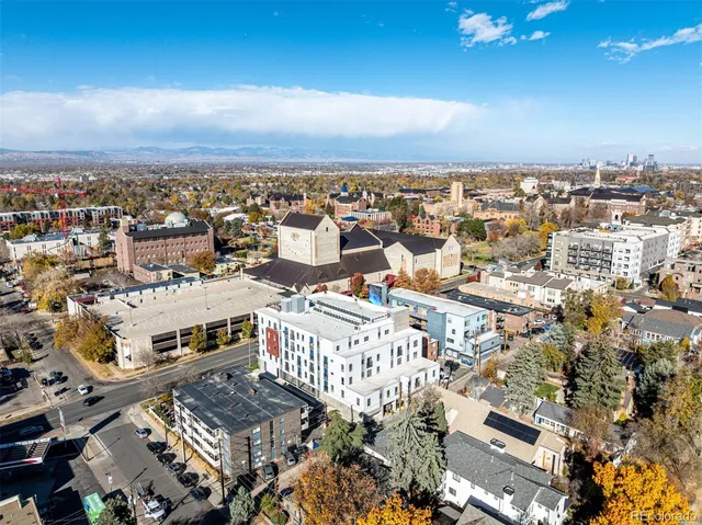 an aerial view of a city with parking space